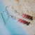 Dainty Niʻihau shell drop earrings with Kahelelani shells in black, brown, burgundy, and pink tones – small authentic Hawaii gift for her