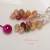 Close up Kauai Kahelelani shell earrings showing natural shell texture and colors minimalist Hawaiian jewelry under $100