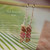 nier_3165
Small Kahelelani shell earrings hanging on hook displaying green Niihau shells with pink and natural brown tones, lightweight minimalist island style earrings with Hawaii shells