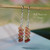 nier_3180
Hawaiian shell earrings hanging on hook showing mixed burgundy, pink, brown and green kahelelani shells in simple drop style, small authentic Hawaii shell jewelry under $100