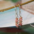 nier_3186
This photo shows the earrings hanging on a hook, giving a clear view of their shape and how they fall when worn. The soft earthy tones and lightweight feel make them a simple everyday pair and a thoughtful gift under $100.