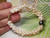 Handheld Niihau shell bracelet with Lenalena yellow and creamy white Momi shells ombre design baroque peacock Tahitian pearl centerpiece 14k gold filled clasp