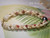 Side view Niihau shell bracelet showing detail of Momi and Kahelelani shells used to create Kipona style handcrafted Hawaiian shell jewelry from Niihau island