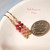 Colorful Hawaiian shell earrings made with tiny Kahelelani shells from Niʻihau, featuring mini Kahelelani shells in pink, red, burgundy, and natural tones, 3/4 inch minimalist drop style with 14k gold filled hooks, $100.
