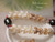 Close up clasp detail of Hawaiian shell lei showing granulated cowrie shells from Kauai at the end, paired with off white Momi shells and secure finish, highlighting clean connection, smooth polish, and careful finishing work in handmade shell jewelry