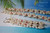 This matching Niihau shell necklace and earrings set is shown with the earrings in front, designed in a flowing Kipona style using Momi and Kahelelani shells. The earrings measure 3 1/4" long and are finished with 14k gold filled hooks.