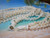 Traditional triple strand Momi shell lei handcrafted with genuine off white shells from Niʻihau. Elegant Hawaiian shell necklace with layered shellwork and classic island-inspired design.