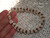 Authentic Niʻihau shell bracelet shown on hand with 14k gold filled safety clasp featuring rare blue ʻŪliʻuli Momi shells and brown Kahelelani shell accents in ombre Kipona style. Traditional Hawaiian shell jewelry bracelet with double-double Pikake tied shellwork.