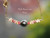 PD_582
This 17 1/4" beach-inspired Hawaiian shell necklace features genuine Kahelelani shells from Niʻihau and Kauaʻi surrounding an organic baroque Tahitian pearl centerpiece, shown hanging.