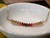 Authentic Hawaiian shell necklace from Niʻihau displayed in a white dish featuring a delicate ombré arrangement of genuine Kahelelani shells with elegant minimalist coastal style.