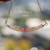 Minimalist curved floating shell necklace handcrafted with genuine Hawaiian Kahelelani shells hanging naturally to showcase the refined island-inspired design and sophisticated tropical beach style.
