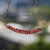 pd_616
Burgundy Kahelelani shell minimalist necklace displayed hanging naturally to showcase the softly curved floating design, handcrafted shell arrangement, and rich natural burgundy color variations of genuine Kauaʻi Kahelelani shells along the gold filled chain.