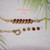 Close-up view of genuine Kahelelani shells arranged in a floating bracelet design beside a gold filled spring clasp. Rare Hawaiian shell jewelry handcrafted with natural ʻōmaʻomaʻo green and mākuʻe brown ocean tones from Niʻihau.