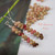lightweight Kahelelani shell earrings at an angle showing natural shell variation from Niʻihau, simple everyday island jewelry