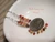 Handcrafted Hawaiian Kahelelani shell earrings featuring colorful Niʻihau shells with chocolate Kauaʻi Kahelelani shells and sterling silver hooks.