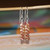 nier_3147
Dainty ombré Kahelelani shell earrings from Kauaʻi handcrafted with chocolate shells and sterling silver hooks, shown hanging to display the drop design.