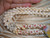 Niʻihau Kipona shell lei #2029 before clasp, handcrafted with Momi, size 11 Kahelelani, off-white Puka shells and Sunrise shell pendant