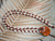 Hawaiian shell lei with white Niihau Momi, burgundy Kauai Kahelelani shells and deep orange Oahu sunrise shell pendant #2030