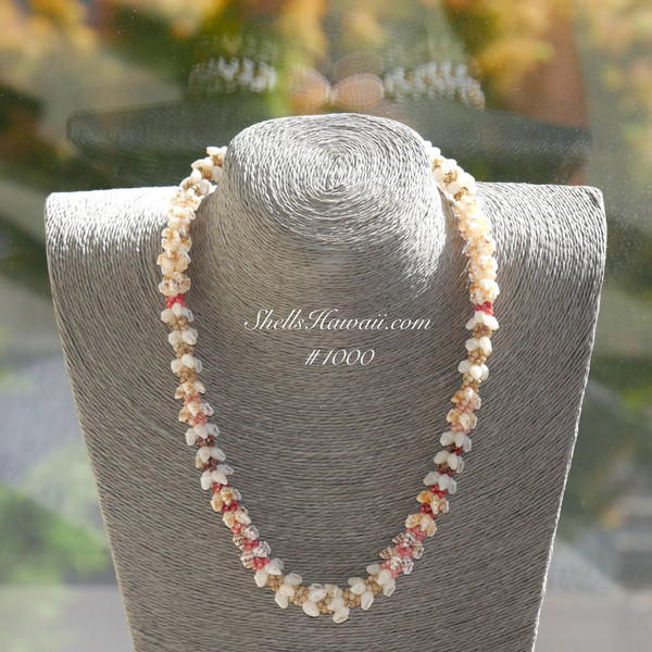 ninl_1000
Front view of Niʻihau shell lei displayed on neck stand, showing overall balance and full design, featuring Momi shells in white, black spotted, yellow, and rare blue tones, with Kahelelani shells in green, pink, red burgundy, brown, black, and keʻokeʻo, length 21", Kipona style handmade Niʻihau shell necklace, one of a kind fine Niʻihau shell necklace for her, price $2550