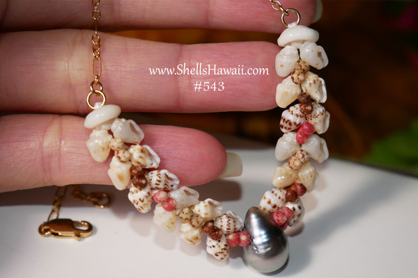 PD_543
Heliconia style shell pendant with genuine Kahelelani and Momi shells from Niʻihau, silver-tone Tahitian pearl, beach style shell jewelry