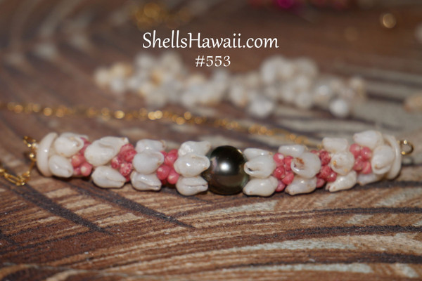 PD_ 553
Niʻihau shell pendant necklace with ombre light blue and white Momi shells, red and pink Kahelelani shells, and Tahitian pearl