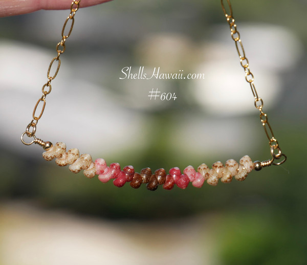 pd_604
Beach-inspired Hawaiian shell necklace hanging naturally to showcase the graceful curved floating design and authentic handcrafted island jewelry from Niʻihau.