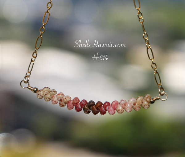 pd_614
Minimalist curved floating Kahelelani shell necklace shown hanging naturally to display the graceful curved shape, flowing ombré shell arrangement, and detailed handcrafted workmanship. Genuine Niʻihau shells in green, Keʻokeʻo, red burgundy, and brown tones create a soft tropical color transition along the gold filled chain.