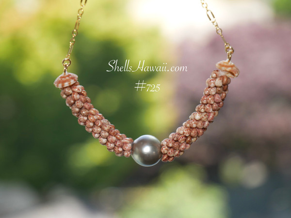 pd_725
Authentic Niʻihau shell necklace handcrafted in a triple strand poepoe design using chocolate Kahelelani shells accented with a silver tone Tahitian pearl and delicate 14k gold filled chain.