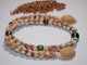 20" Niʻihau shell lei & earring set — four-strand Kipona style with Momi and Kahelelani shells, centering a green pistachio Tahitian pearl for elegance
