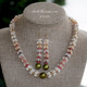 Option 1 (Niʻihau shell lei):
18¾" Niʻihau shell lei & earring set in Kipona style with Momi, ʻŌnikiniki, Kahelelani shells, accented with green pistachio Tahitian pearl center and earrings