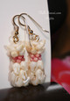 Close-up of Pineapple motif showing the contrast between creamy off-white and blush pink shells, layered in four cascading strands; finished with 14K gold-filled hooks for polished shine.