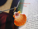 Orange and pink Hawaiian sunrise shell pendant with authentic Niʻihau shells and Kahelelani flower accent