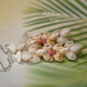 1 ½″ Pupu O Niʻihau Kipona style earrings blending ivory keʻokeʻo, golden yellow lenalena, light blue uliuli, and tiny pink ʻākala pua Kahelelani shells in a joyful mixed-cluster design.