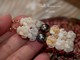 2 1/8″ Niʻihau Momi crown flower earrings combining genuine shells in shades of light blue (Momi ʻŪliʻuli ʻĀhiehie), golden yellow, and pure white, accented with peacock baroque Tahitian pearls. Handcrafted, luminous ocean-inspired palette.