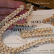 Authentic Niʻihau Momi Lenalena Pikake style lei 21" with golden yellow and black-lipped shells, #1099.