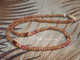 17" restored Kahelelani shell lei in burgundy, golden yellow, pink, and natural brown with 14k gold-filled clasp