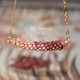 18" three-strand Kahelelani Poepoe pendant necklace with burgundy and natural brown shells from Kauaʻi, gold-filled Italian chain