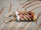 1 1/4" Niʻihau Kahelelani shell earrings in yellow kamoa, red burgundy, green, and natural keʻokeʻo colors, 4-strand Poepoe style.