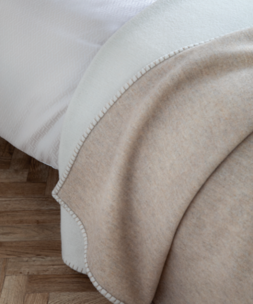 Johnstons of Elgin Merino Wool and Cashmere Reversible Blanket Stitched Bed Throw in Ecru/Driftwood