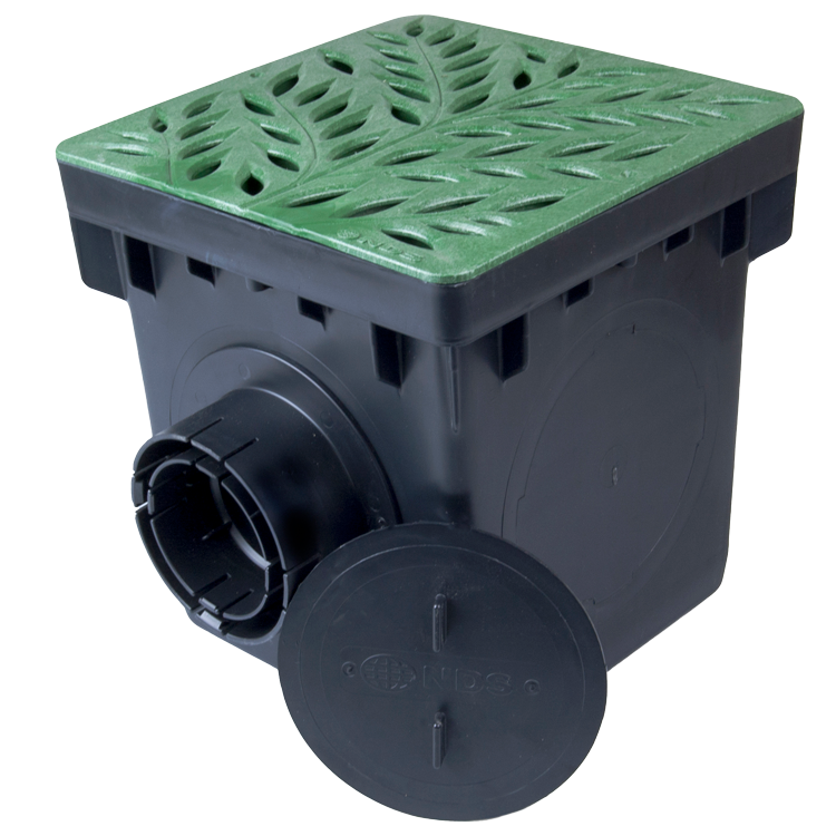 NDS catch basin system installed in landscape application for collecting and managing surface water runoff.