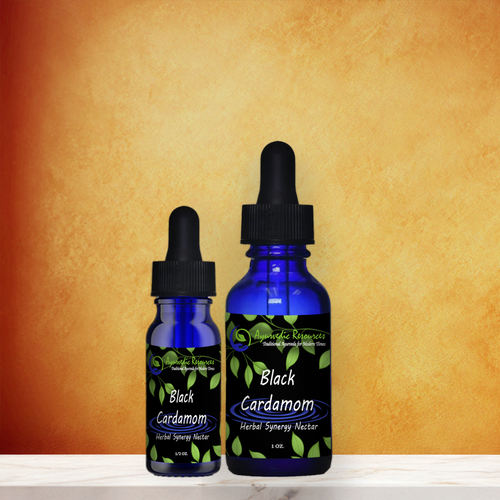 Black Cardamom Herbal Synergy Nectar on a marble counter.