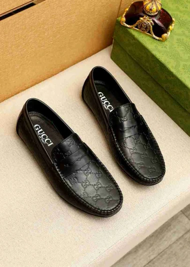 Gucci Black Leather Embossed Loafers