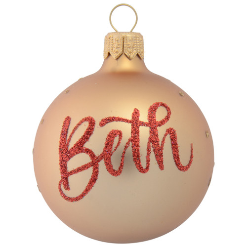 christmas bauble in gold with shooting star