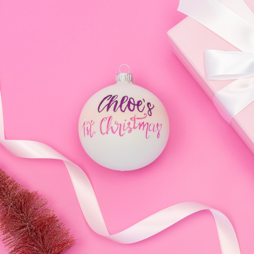 white and pink personalised 1st christmas bauble with name