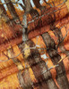 Détail des pieds et structure du fauteuil Firen, aspect robuste et design moderne