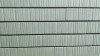 Vue frontale du carreau façade vertical long 5,4 x 36 cm S.02 en gris, graphite, blanc et écru.