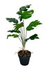 Plante artificielle Monstera avec feuilles perforées, hauteur 52 cm, réalisme élevé.