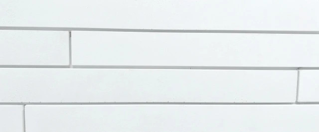 Carreau façade blanc lisse 5,4 x 54 cm, aspect moderne et épuré.
