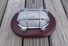 chrome nautical light with wooden trim plate