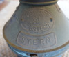 copper stern tag on vintage nautical light